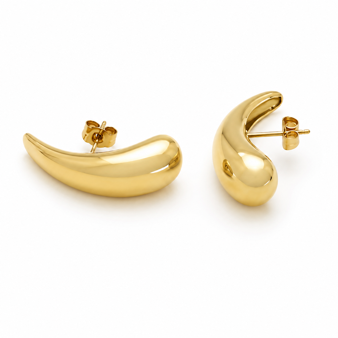 Gold curved earrings on a white background